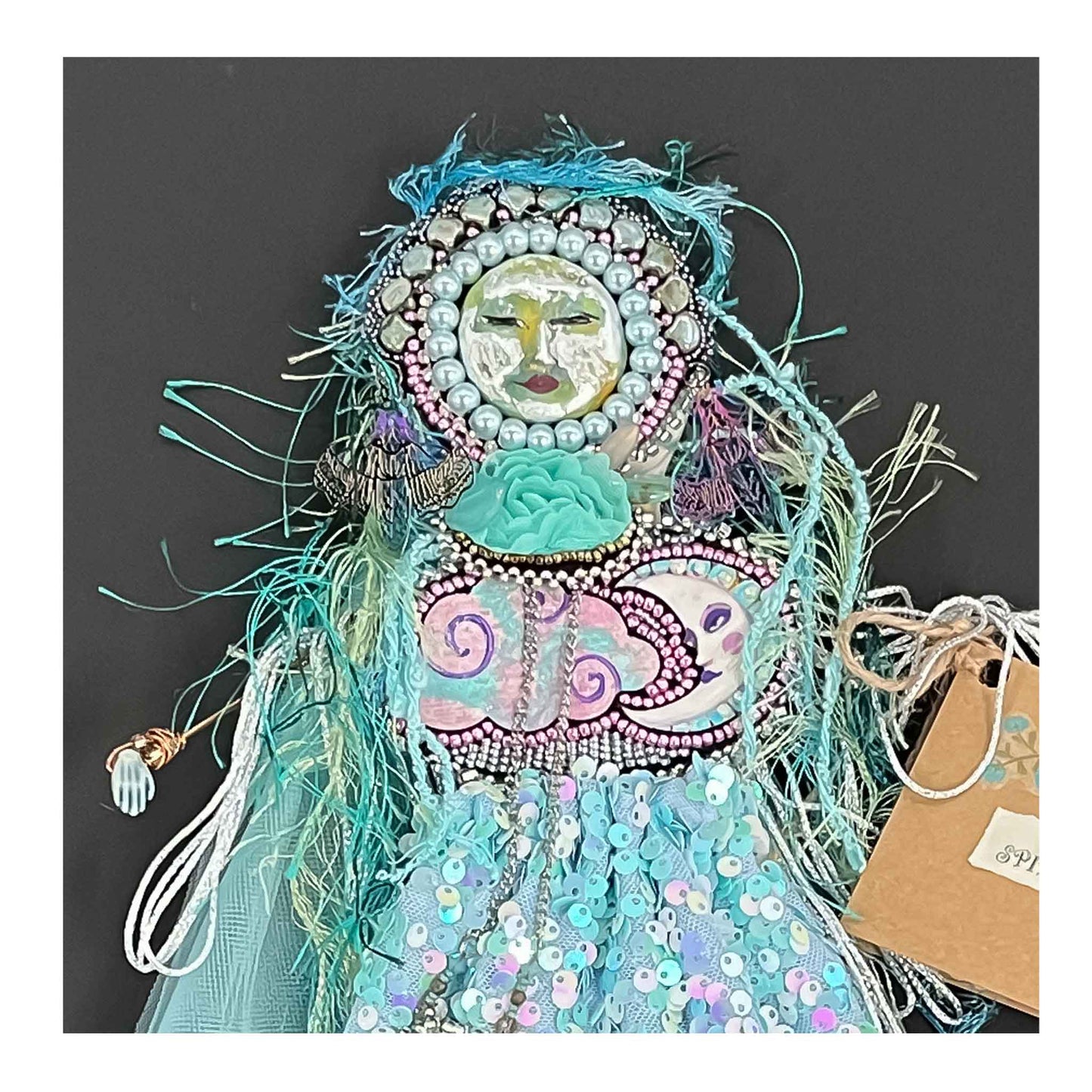 Spirit of Dreams, Doll, Wall Hanging, aqua sequins, netting, bead embroidery, wood, cloud, moon, ceramic hands and feet, polymer clay face, pearls, wire, fringe, yarn ,fabric, 16 X 7