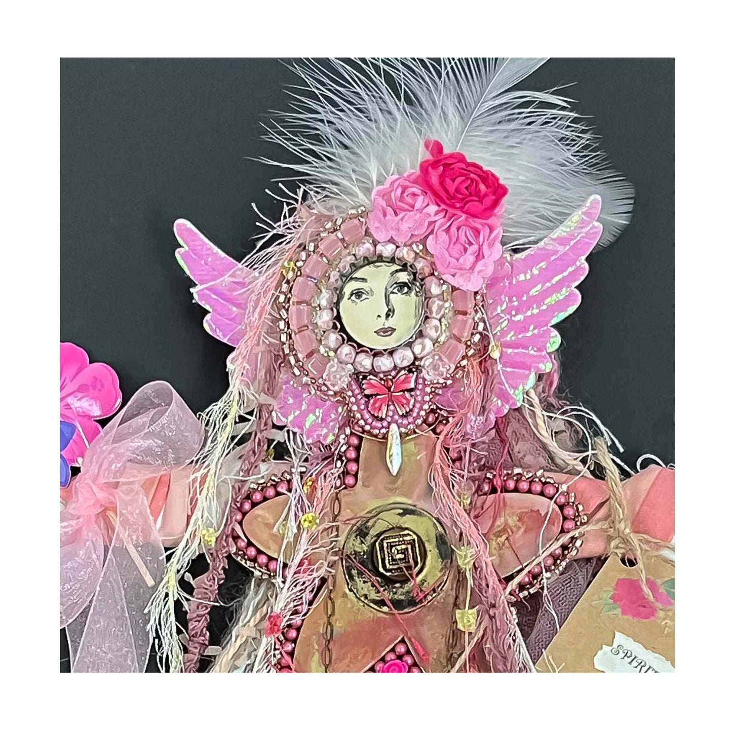 Doll, Spirit of Hope,  pink chiffon,  bead embroidery, encaustic, painted wood, ceramic shoes, flowers, a butterfly. a necklace, wings, wire, fabric, yarn, feathers, 16 X 9