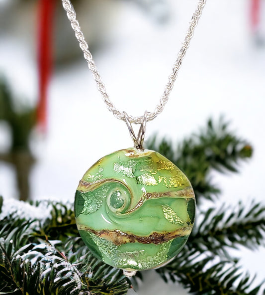 Lampwork pendant necklace,  silver and emerald green. Pendant is 1.25", 18" sterling silver chain.  Handmade Lampwork glass by June Knowles