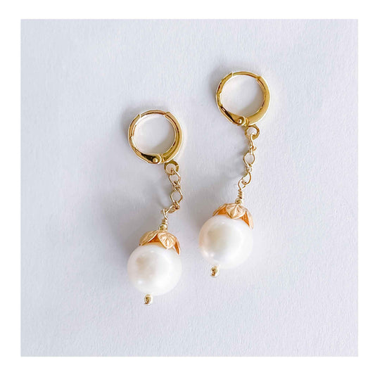 White freshwater pearls, with gold plated caps, gold-filled lever backs, 1” long